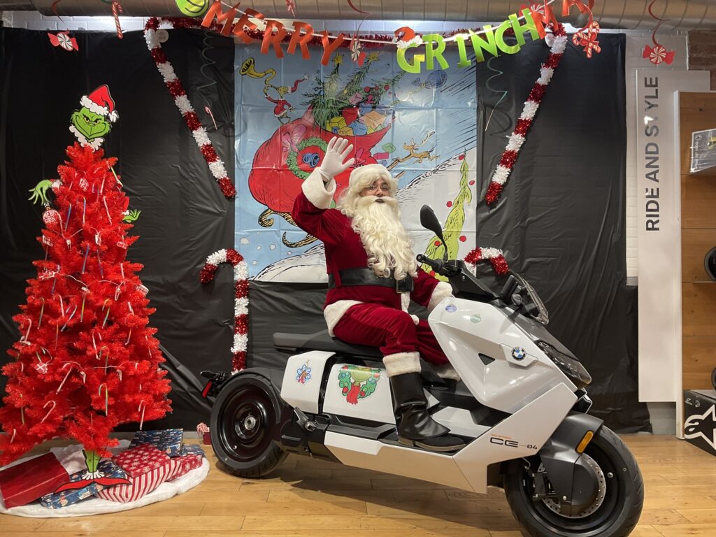 Santa on a BMW CE04 in Grinchland